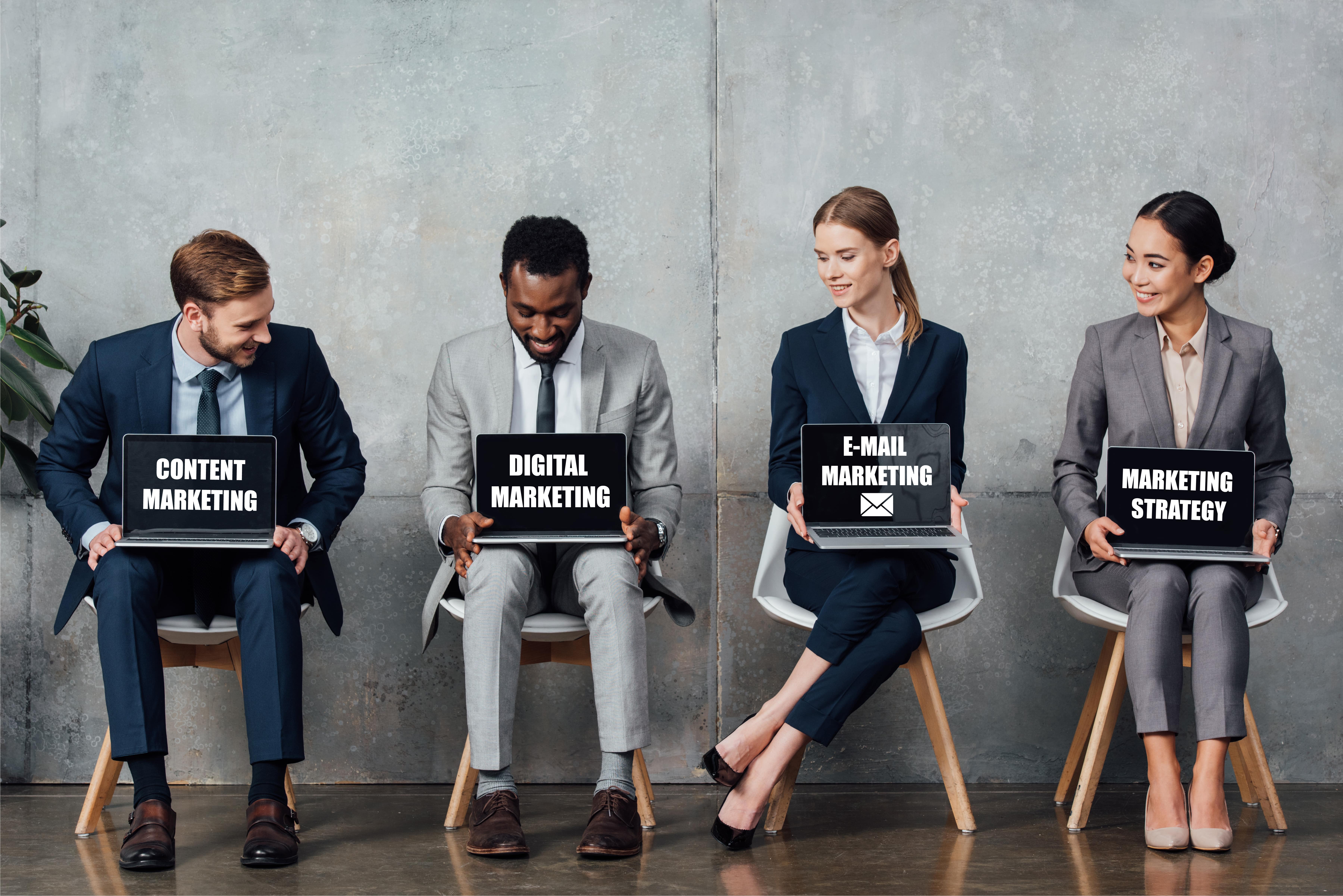 smiling-multiethnic-businesspeople-sitting-on-chai